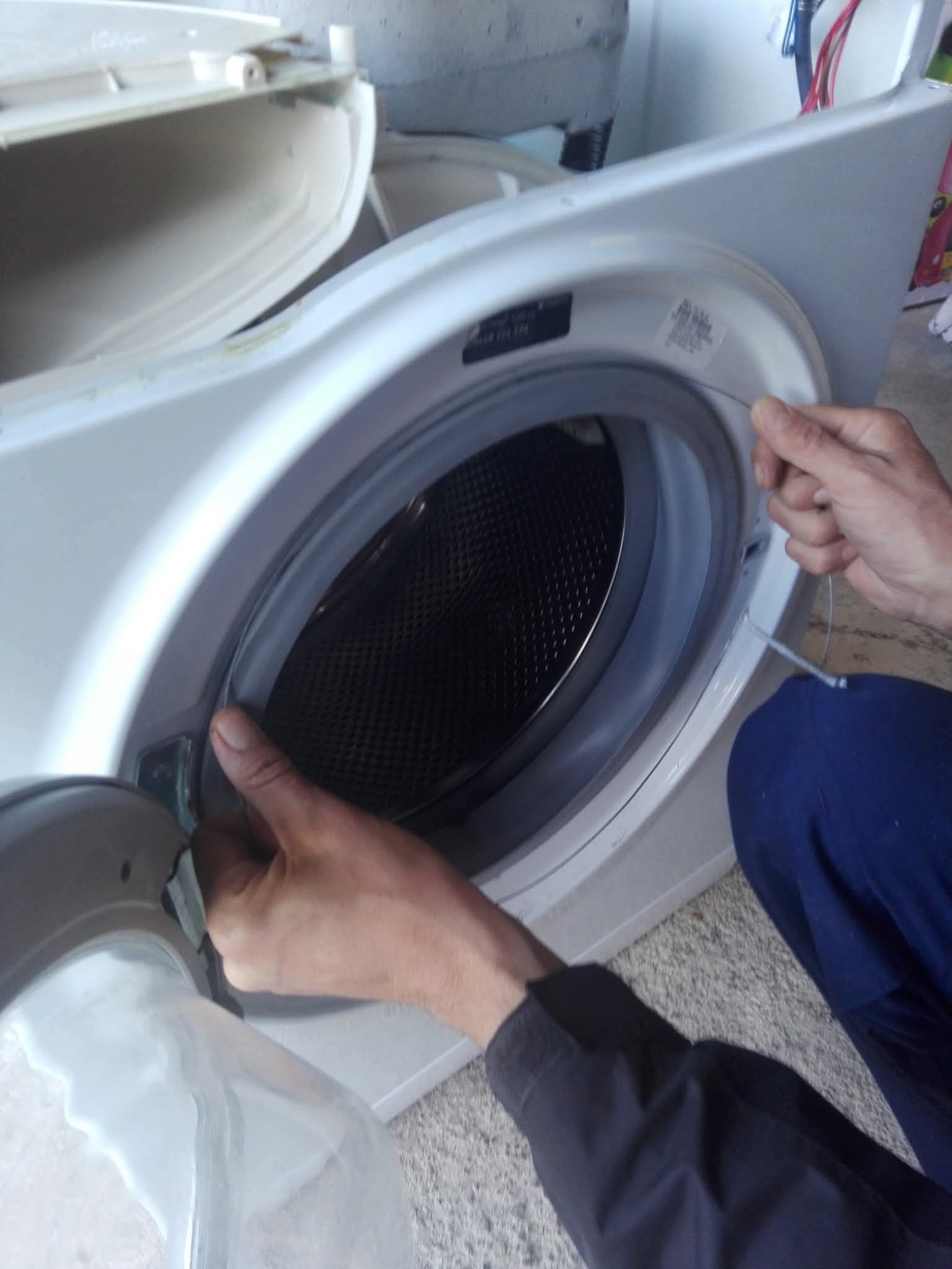 Checking washing machine door mechanism